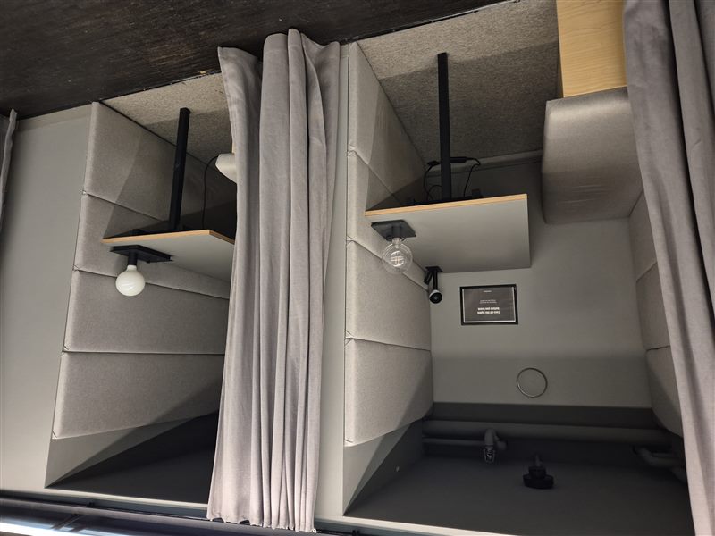 Compact coworking desks in a bright room with wooden furniture
